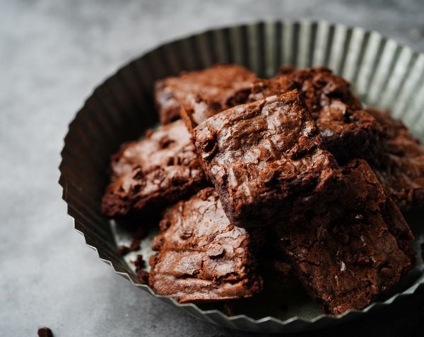 A tray of oat milk salted caramel chocolate brownies