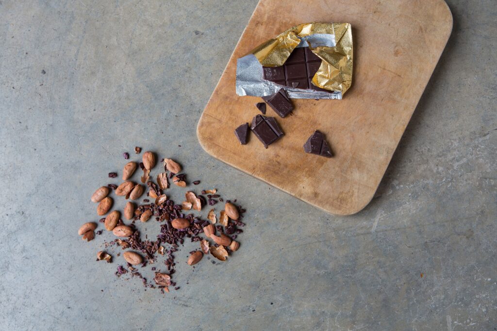 Broken up nuts and cut chocolate on a table