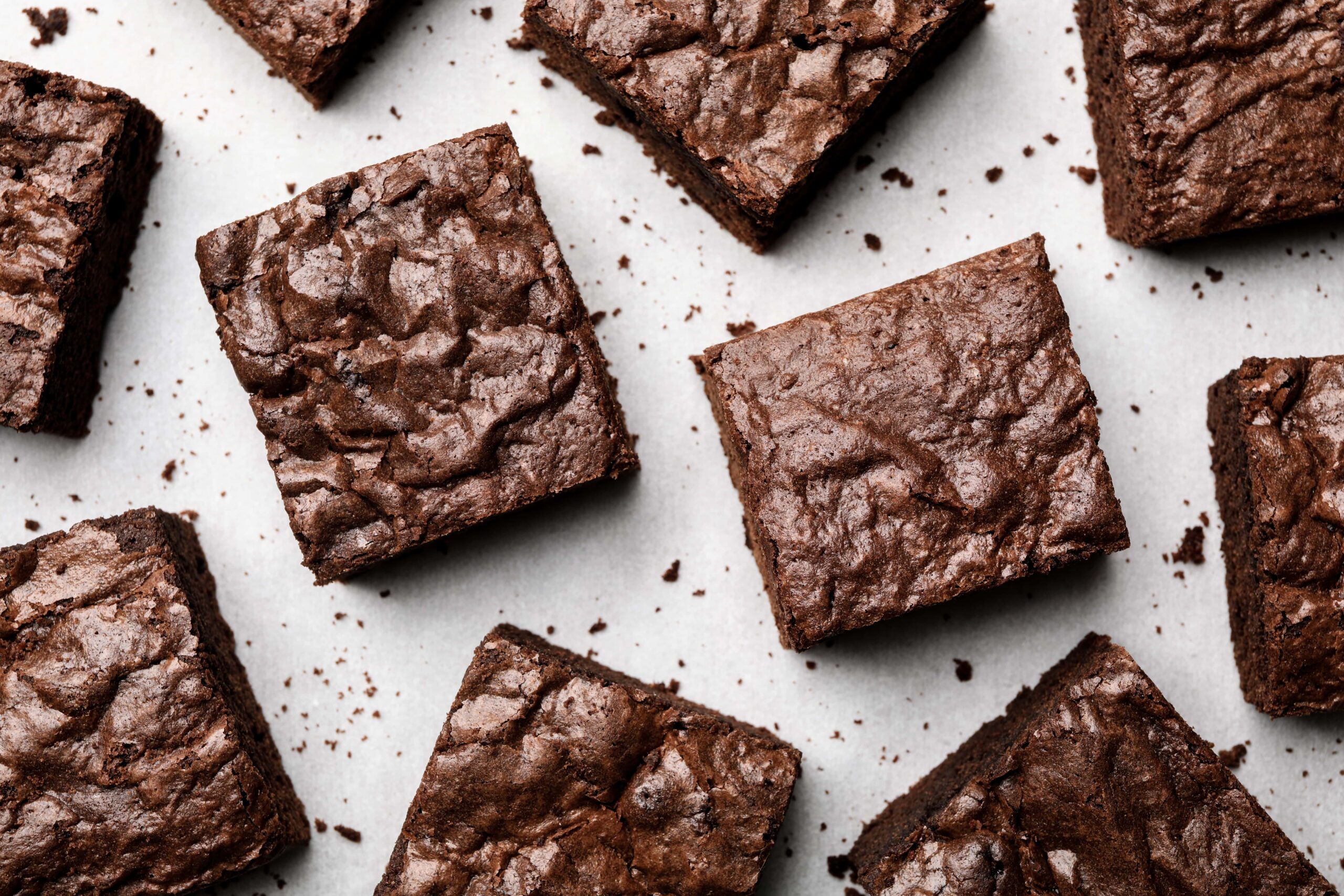 Chocolate brownies laid out on a table