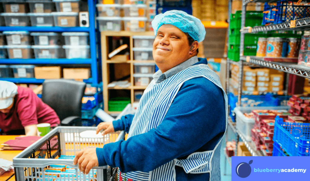 A man working in a factory, with the blueberry academy logo in the corner