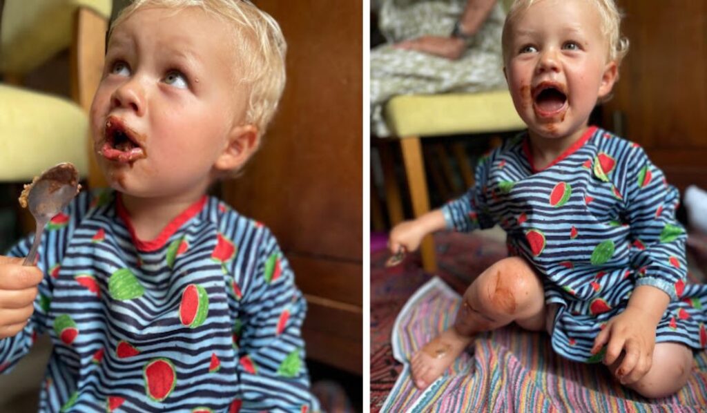 a little boy eating chocolate