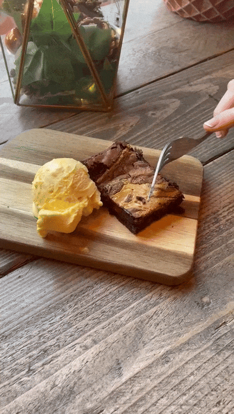 Peanut butter brownie next to ice cream