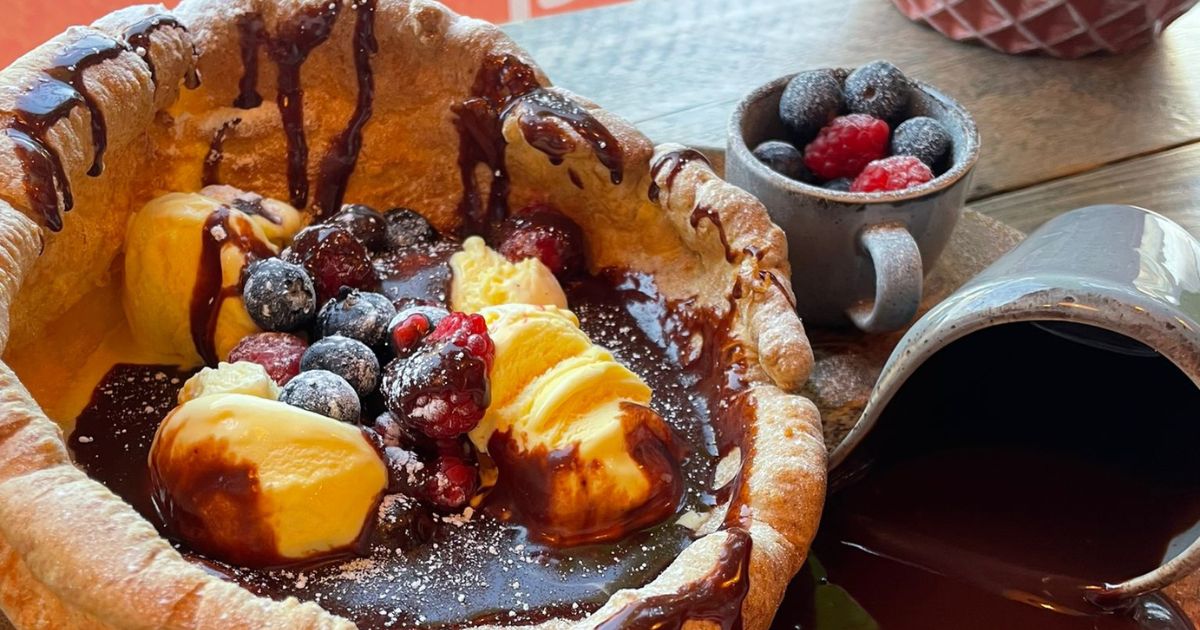 Giant Yorkshire pudding with ice cream, chocolate and berries